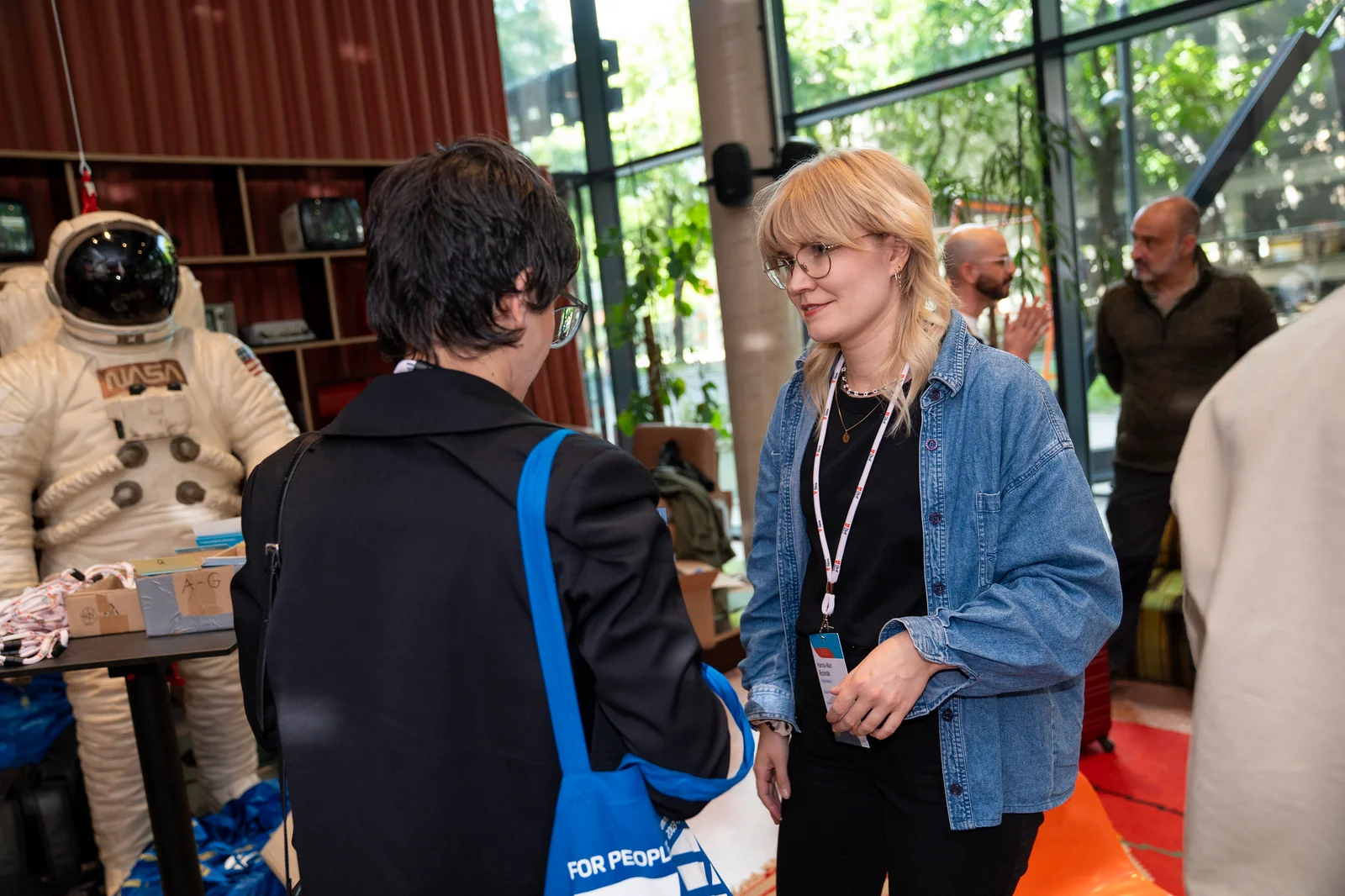 Delegates talking at the WSA Global Congress welcome and registration area.